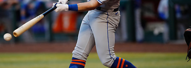 A baseball player hits a ball in the Japanese NPB league