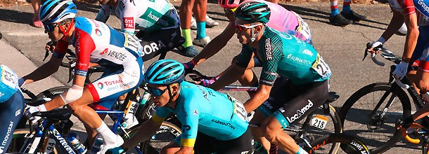 Cyclists battle for position during a road race